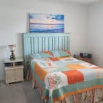Comfortable bedroom with ocean-themed decor at 220 Santa Maria Street.
