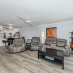 Spacious living room with comfortable gray sofas and contemporary decor at 220 Santa Maria Street.
