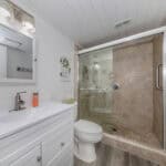 Modern bathroom with walk-in shower at 220 Santa Maria Street.