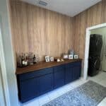 Blue sideboard with decorative items in a contemporary home.