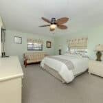 Bright bedroom with comfortable bed and natural light at 345 Three Lakes Lane. Perfect for relaxing.