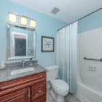 Bathroom with walk-in shower and modern fixtures.