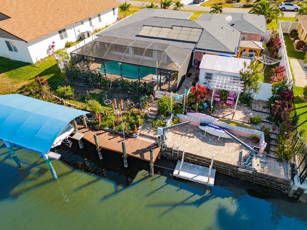 Beautiful waterfront property featuring a swimming pool and boat dock in Port Charlotte. Perfect for.