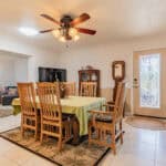 Bright dining room with wooden table and chairs in Port Charlotte home.