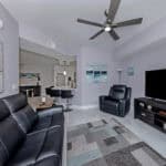 Living room with contemporary furniture and ocean-inspired decor in Venice, FL.