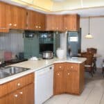 Bright kitchen with wooden cabinets and modern appliances in Venice, FL.
