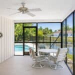 Screened porch overlooking lake in Venice, FL.
